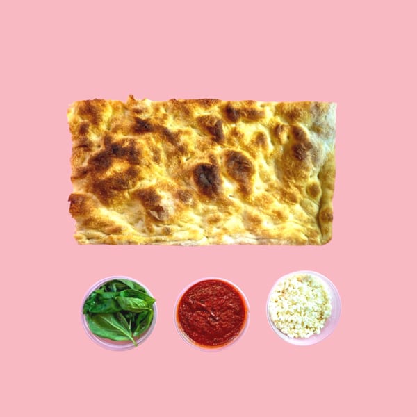 A rectangular pizza crust with basil, tomato sauce, and cheese in separate containers below.