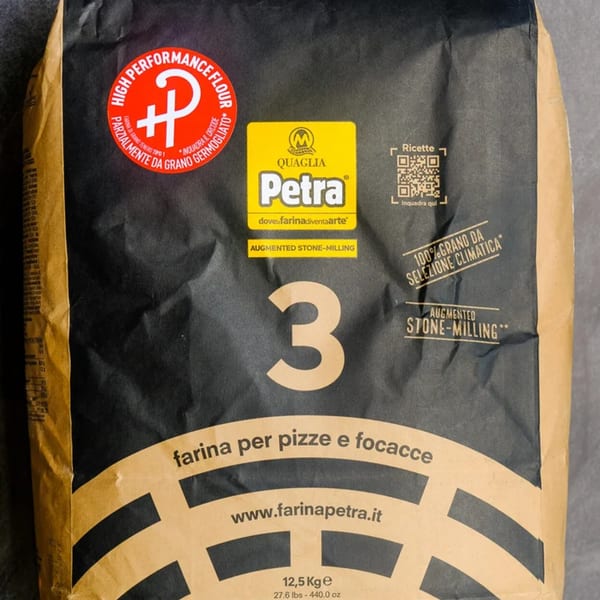 A large bag of Petra 3 pizza and focaccia flour, a key ingredient for Pizza Collective.